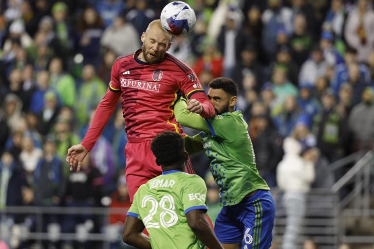 St. Louis City forward Klauss (9) heads the ball against Seattle Sounders midfielder Joao Paulo (6) during the second half at Lumen Field.