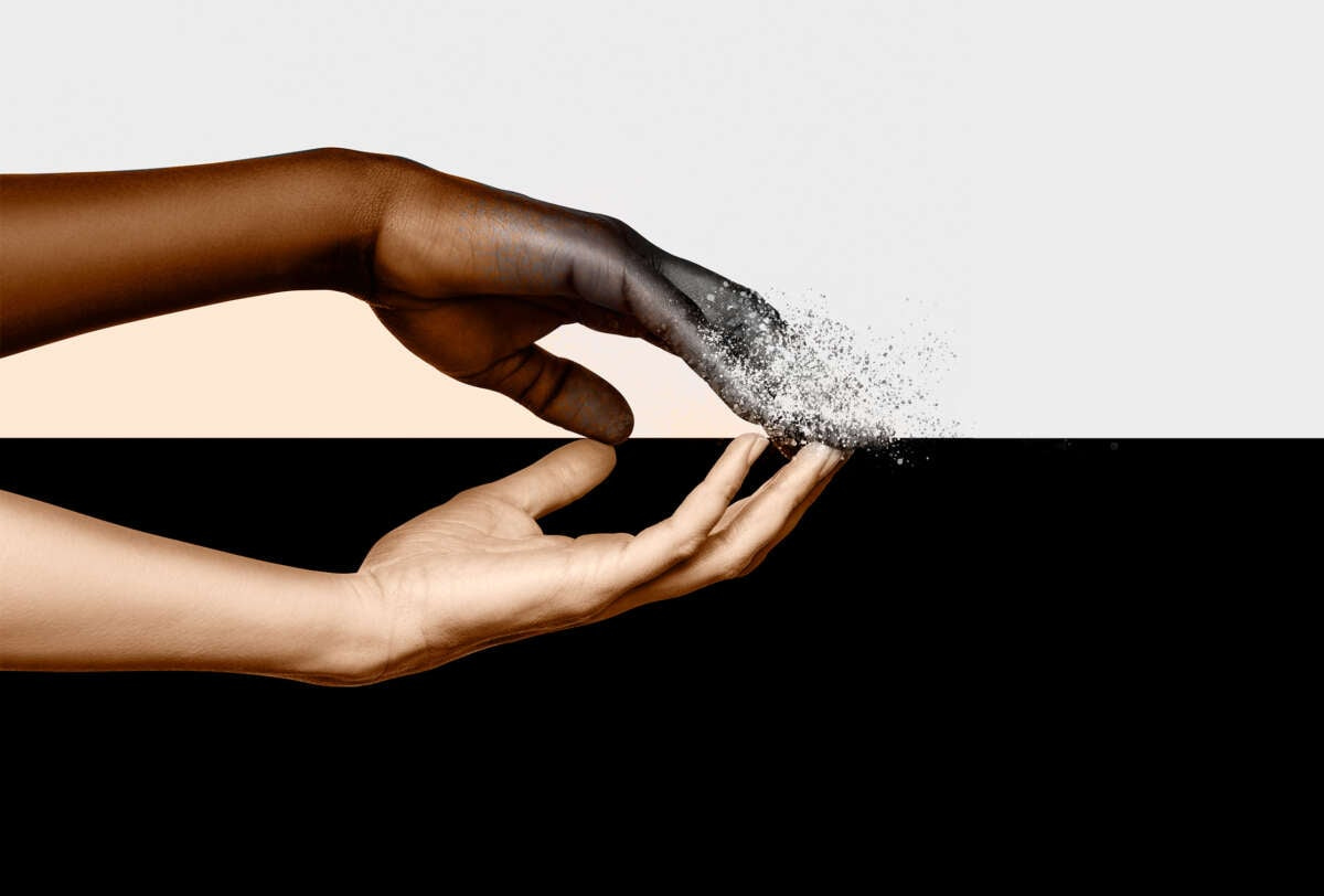 A white and Black hand mirror eachother in a photo collage. The Black hand is disintegrating, while the white hand remains solid.