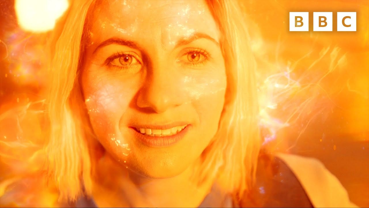 This close-up shot of the Thirteenth Doctor's (Jodie Whittaker's) face as she regenerates shows the Doctor smiling in joyful anticipation of what happens next. Amber regeneration energy covers the entire frame. This close-up shot of the Thirteenth Doctor's (Jodie Whittaker's) face as she regenerates shows the Doctor smiling in joyful anticipation of what happens next. Amber regeneration energy covers the entire frame.