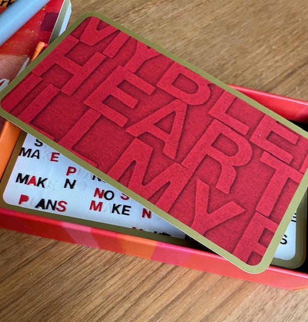 Photo of a red card with the word heart in block letters.