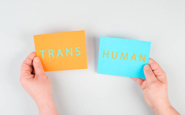 the word transhuman is standing on two pieces of paper, holding the message in the hands, future technology, post human, science, transformation - transhumanism bildbanksfoton och bilder