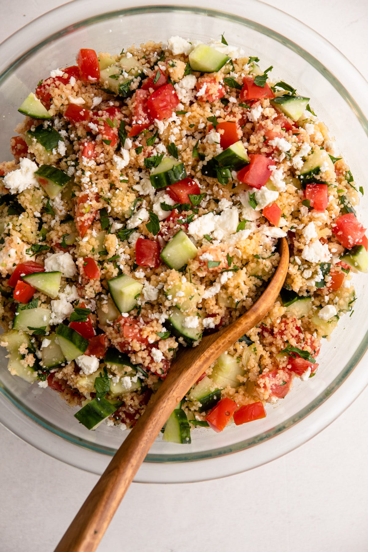 Couscous salad with cucumbers, feta and tomato  in a bowl