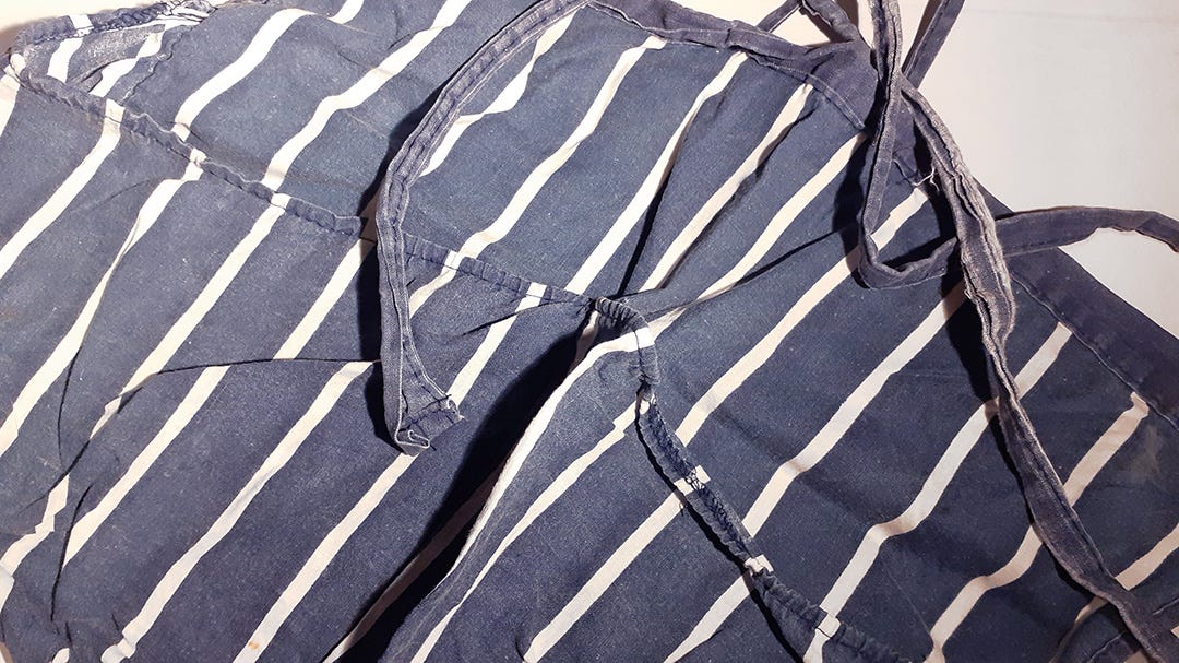 blue peg apron with white stripes