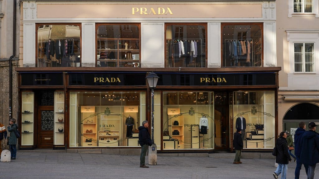 prada acquire versace