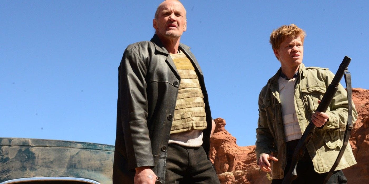 Jack and Todd with guns in the desert