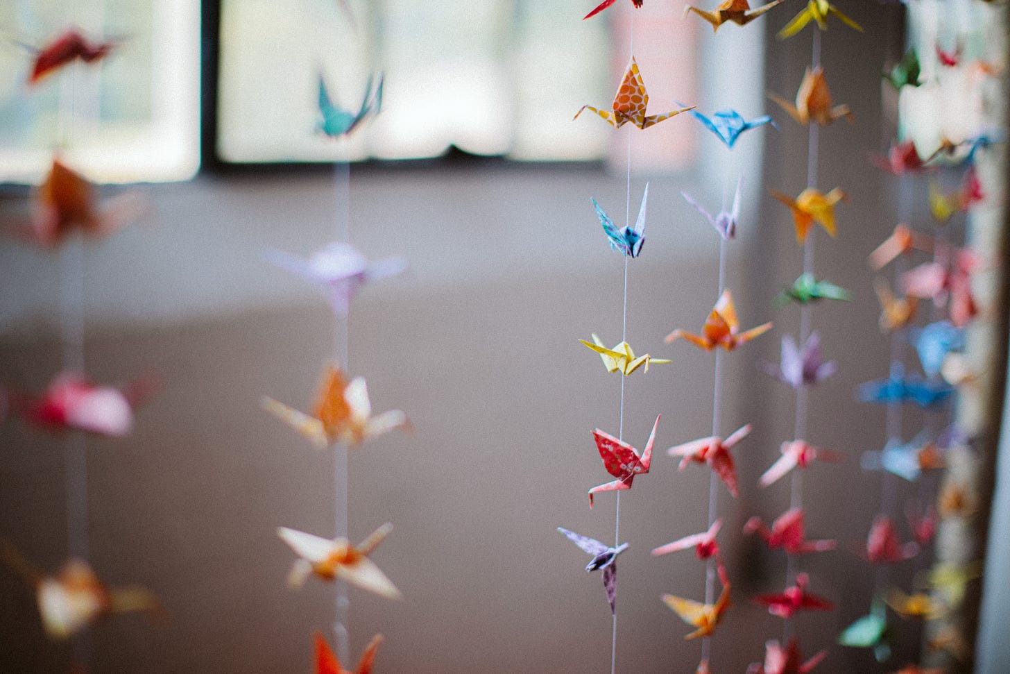 Colorful origami paper crane garlands from Erika's wedding.