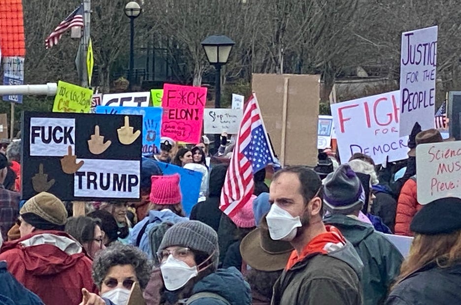 Many masked protestors brought their grief and masterful vocabulary to Olympia on February 17, 2025.