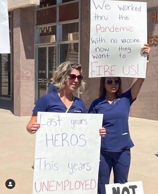 May be an image of 2 people, people standing and text that says "We Worked thru the Pandemic With no vaccine now they want to FIRE US! ast years HEROS This years UNEMPLOYED NAT"