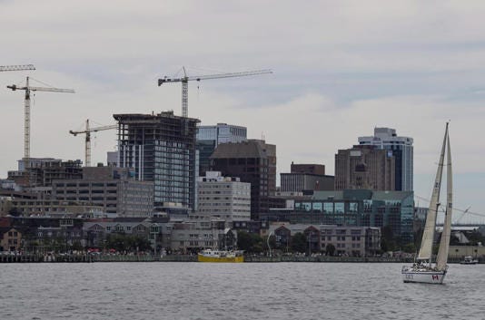A sailboat is seen in front of the Halifax skyline as construction cranes work in the background on Sunday, July 31, 2016. Nova Scotia's deputy minister of housing says about half of the 7,000 households on the wait list for public housing are seniors. THE CANADIAN PRESS/Darren Calabrese
