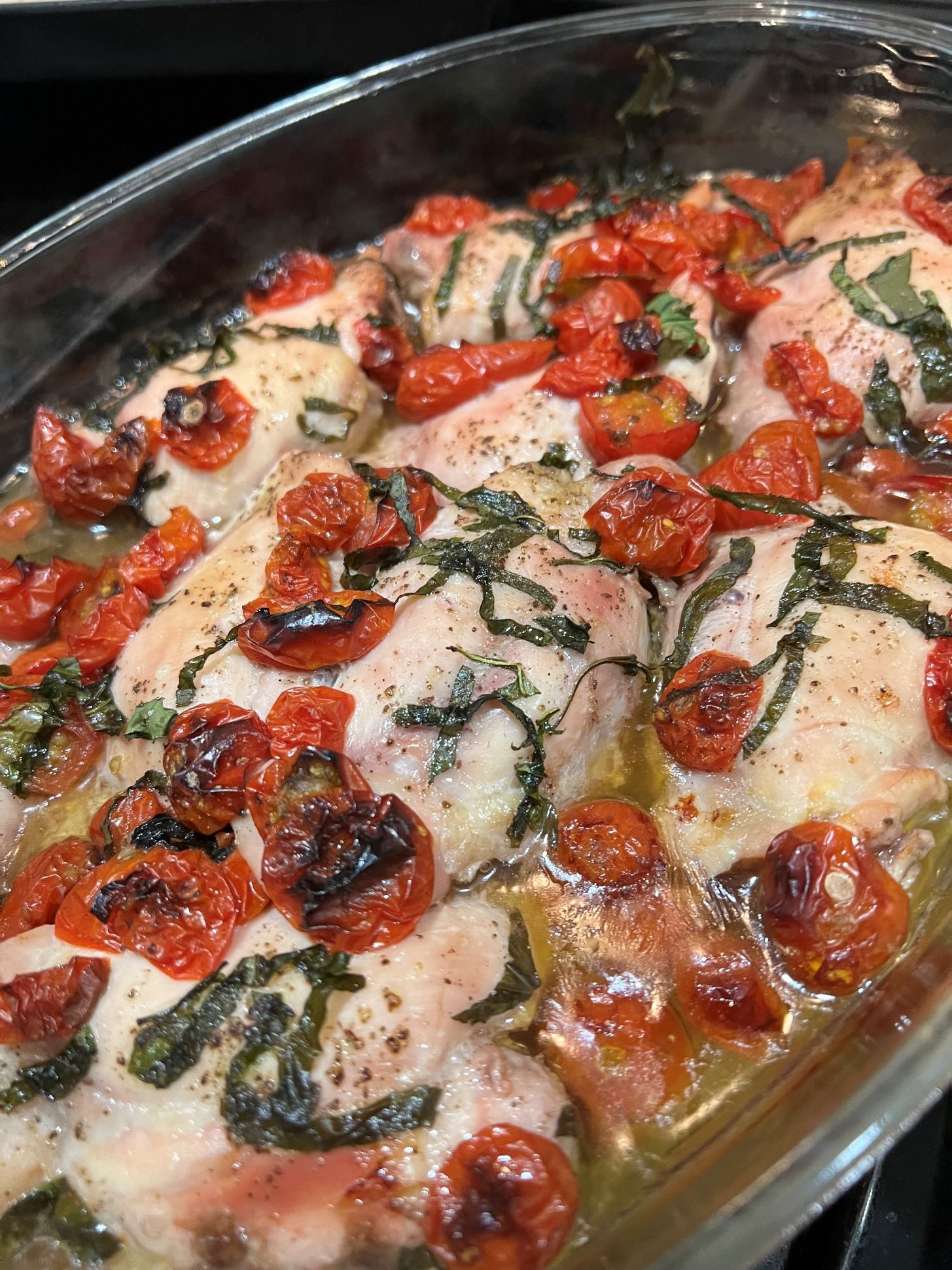 Baked chicken thighs with basil and tomatoes