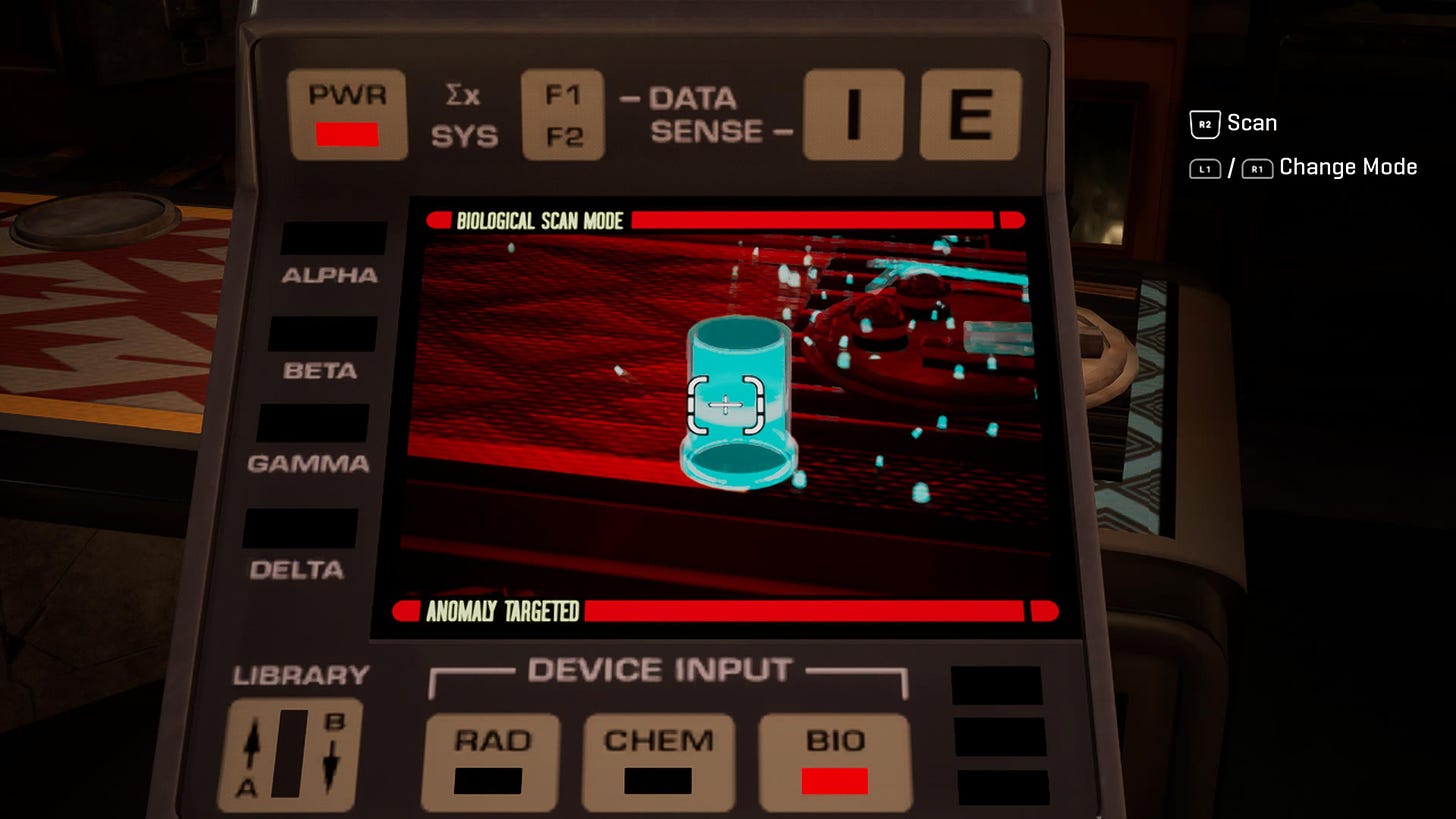 A tricorder with a screen in red and black, showing a highlighted object in blue