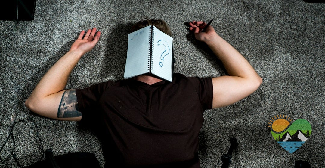 person in black shirt holding white paper