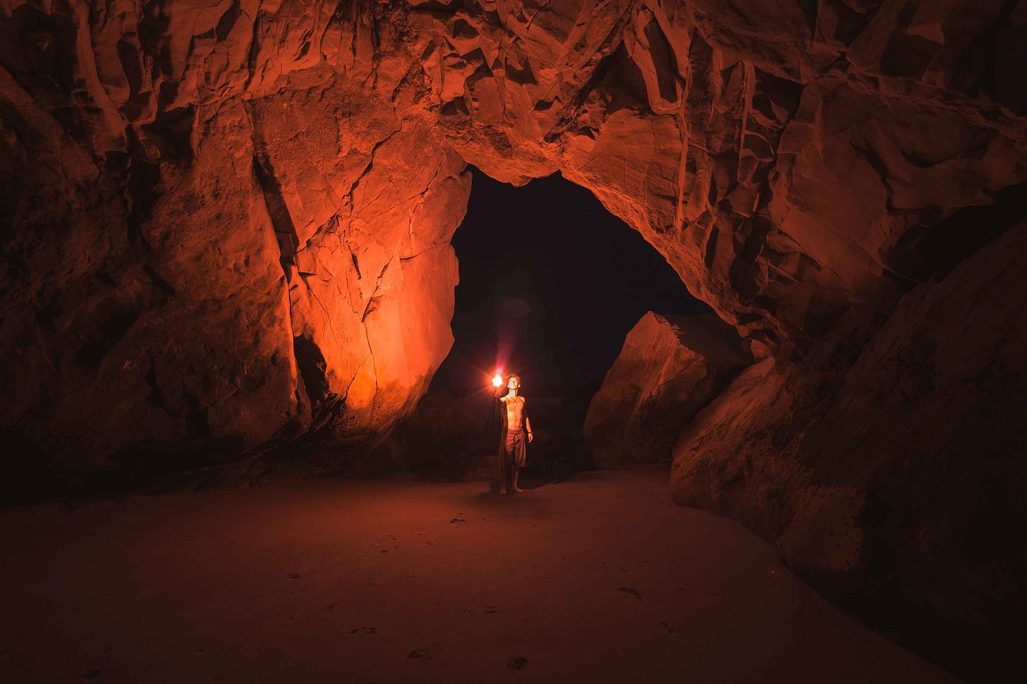 photo of man in cave by Jeremy Bishop via Pexels