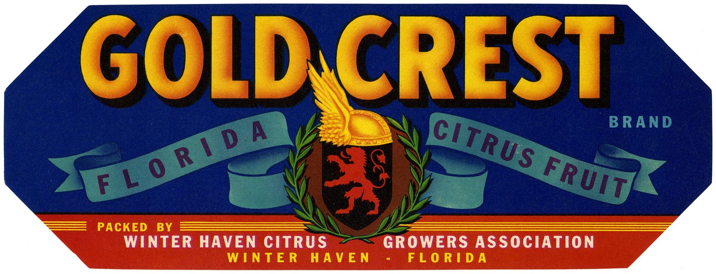 Citrus label with the words Gold Crest in gold against a blue background.