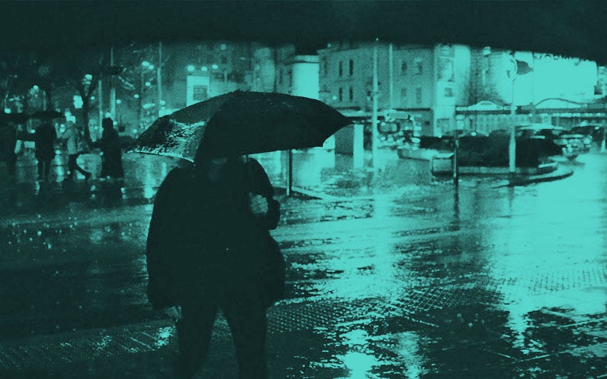 Bristol in wet weather – umbrellas and slick roads.