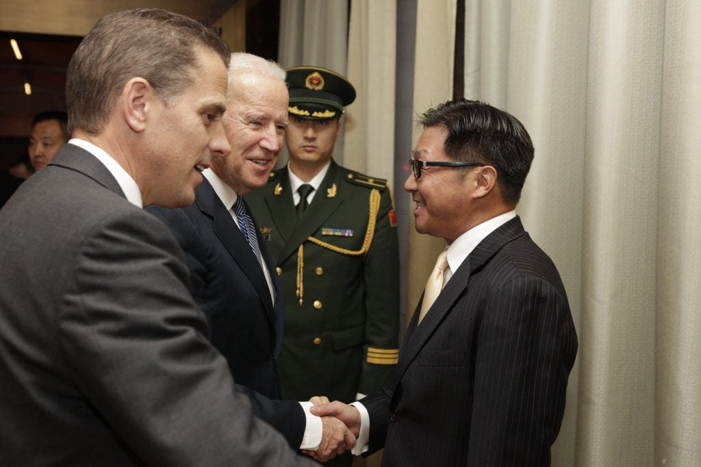 Joe Biden is pictured shaking hands with BHR Partners CEO Jonathan Li.