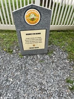 a picture of a fake gravestone in an ice cream flavor graveyard