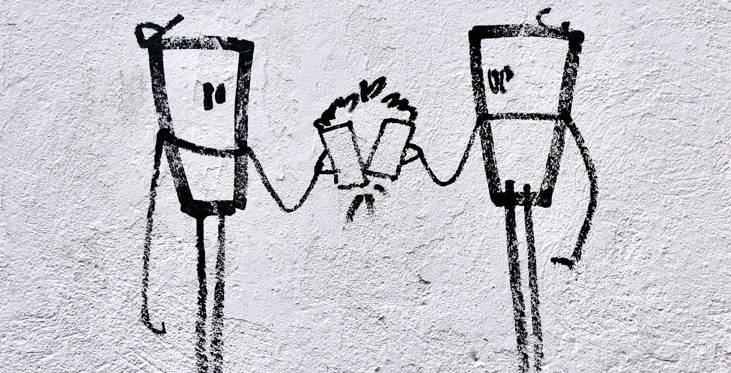 graffiti of two cups cheersing