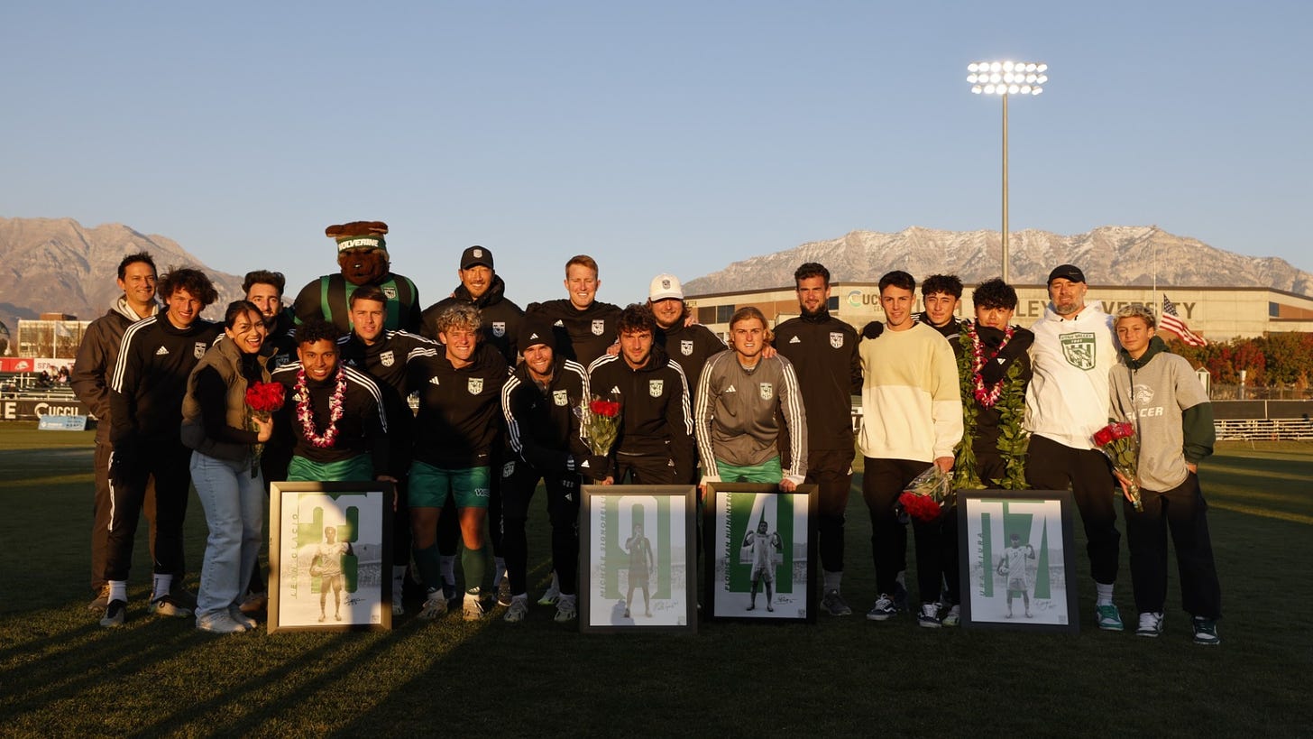 2023 seniors posing with the coaches