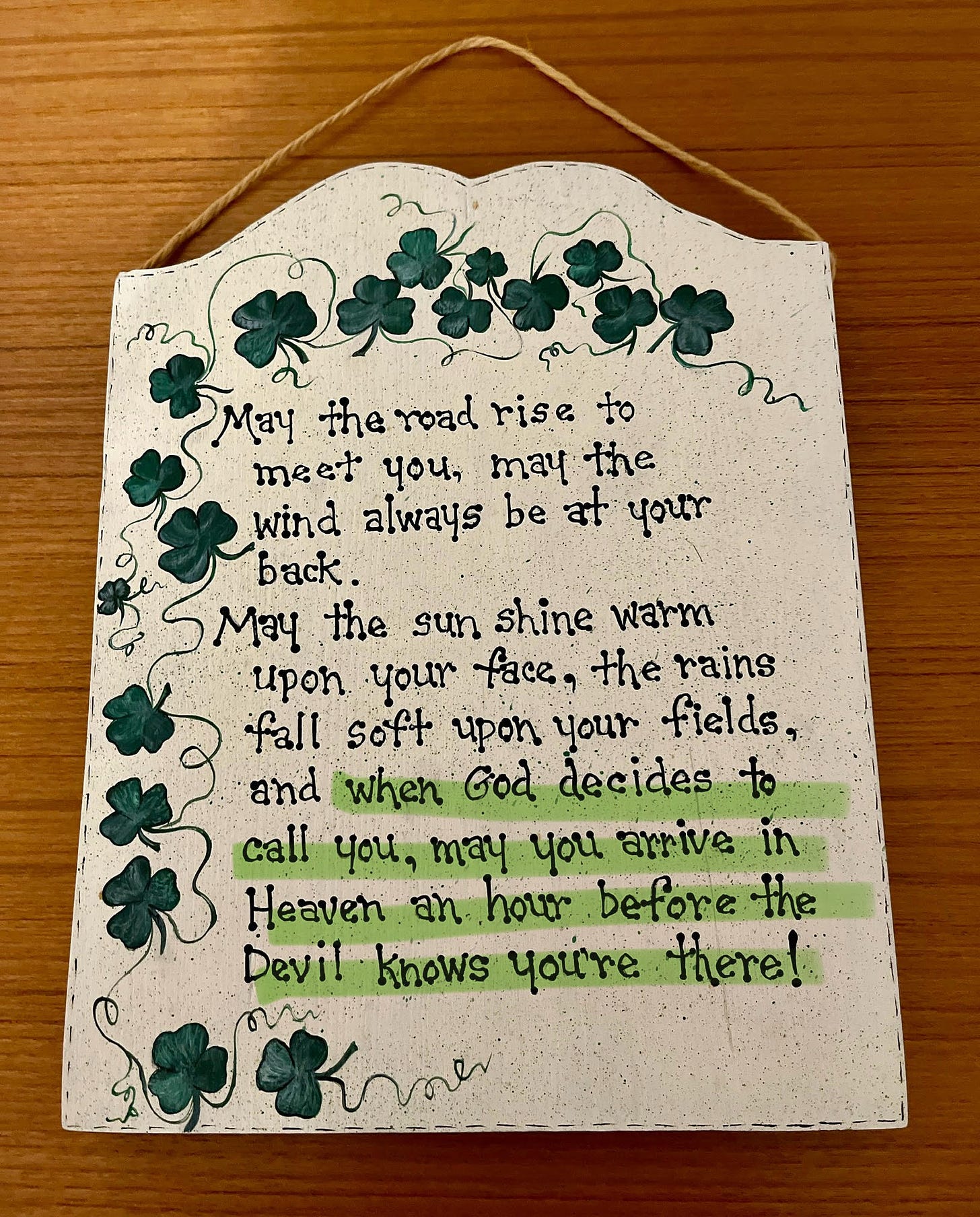 A wall plaque featuring these words surrounded by shamrocks: "... when God decides to call you, may you arrive in Heaven an hour before the Devil knows you're there!"