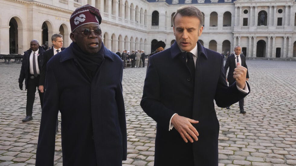 Nigerian President Bola Tinubu and French President Emmanuel Macron at the Les Invalides monument in Paris on 28 November, 2024.