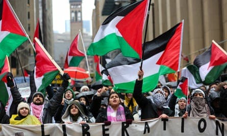 Demonstrators march in downtown Toronto, Ontario.