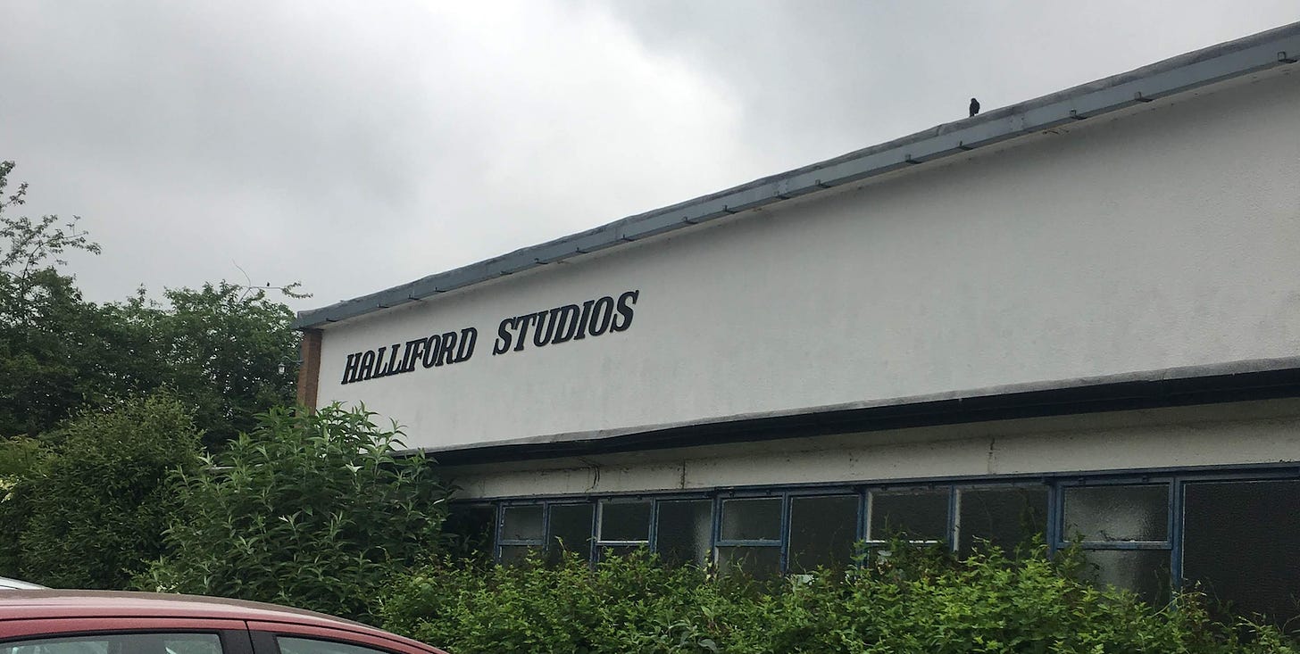 Halliford Studios building. Black lettering on a white fascia.