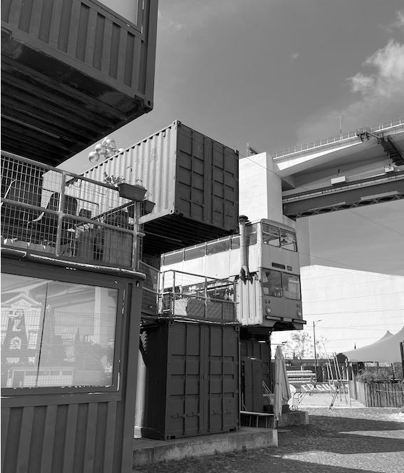 Photograph of shipping containers and a bus at Village Underground