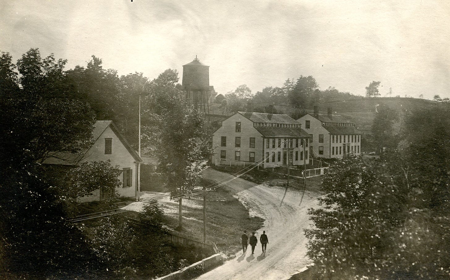 Three men walking down the road