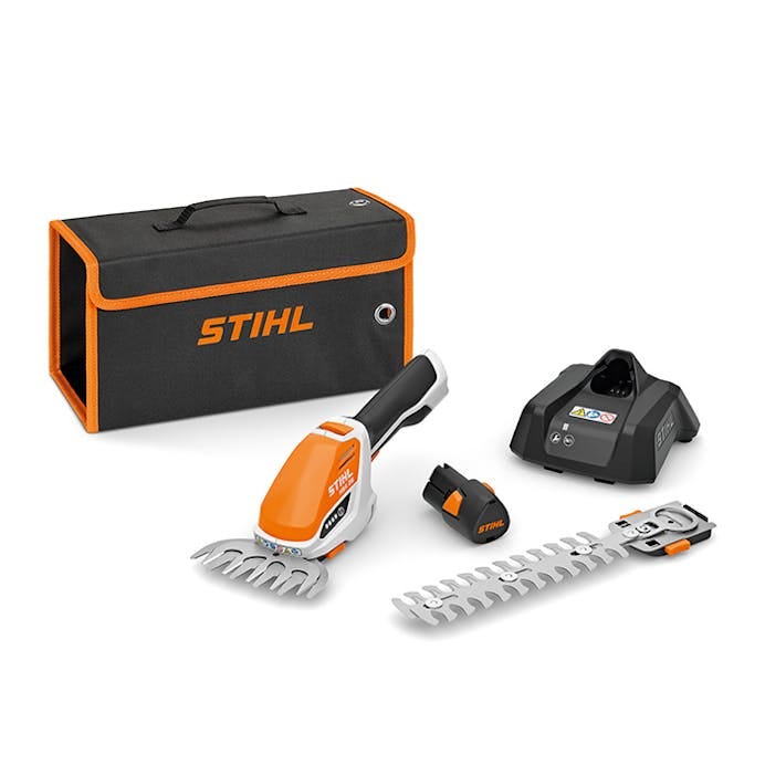 HSA 26 kit featuring battery, charger, interchangeable blades, and a transport bag