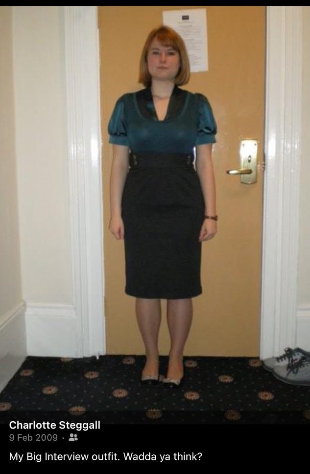 Me stood in front of a hotel room door in 2009 wearing a pencil skirt and emerald green top. I have a look of fear in my eyes!