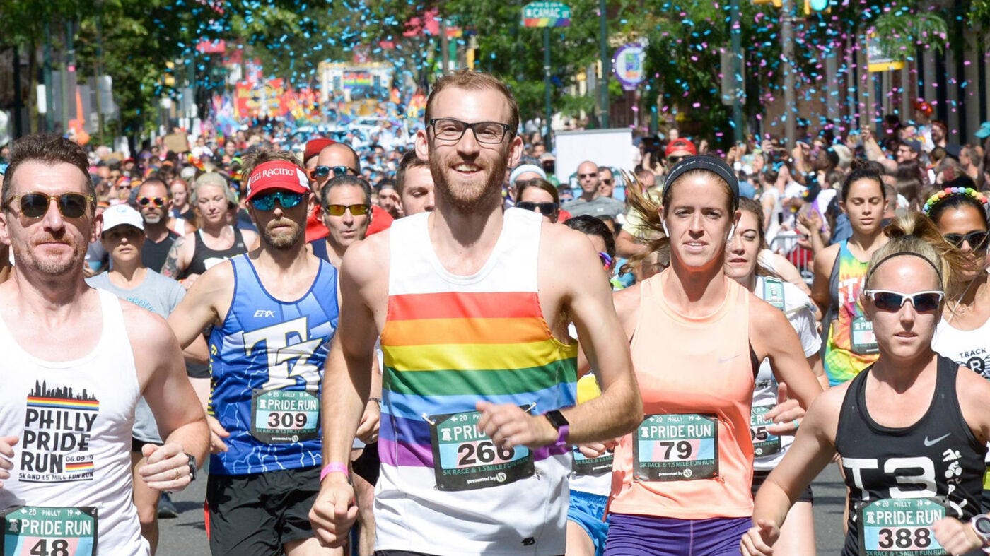 Runners compete in a race during Pride month.