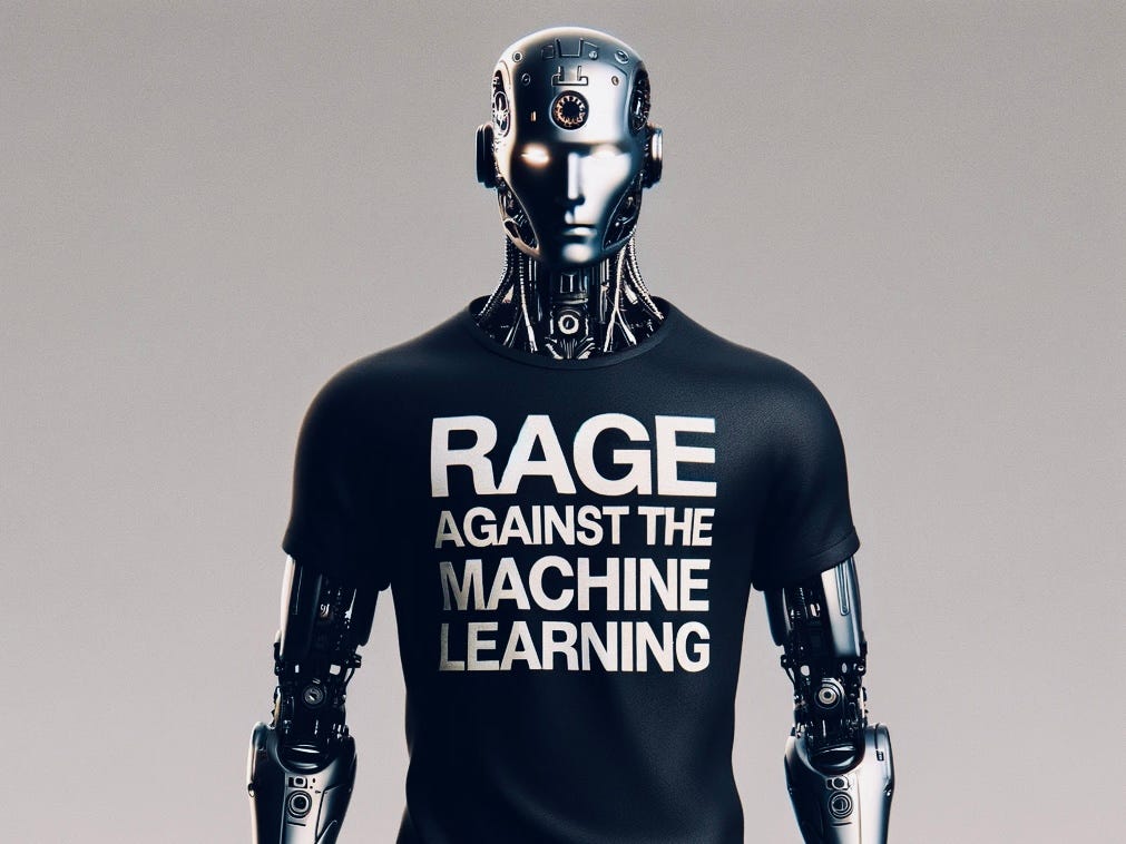 A chrome humanoid robot wearing a black t-shirt with white text reading ‘Rage Against the Machine Learning’. Image generated by Dan Taylor-Watt using DALL-E 3
