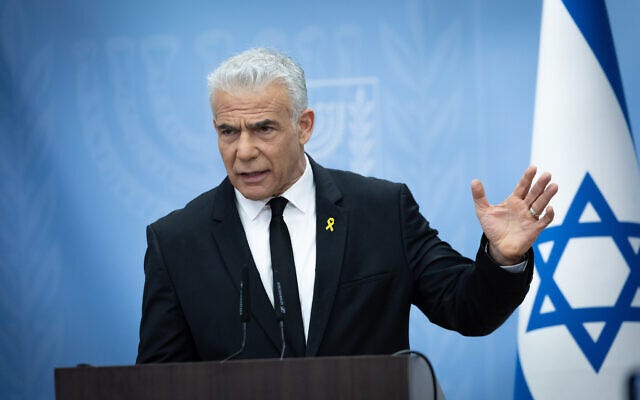 Yesh Atid party head Yair Lapid gives a statement to the media on the Meron disaster report at the Knesset on March 6, 2024. (Yonatan Sindel/Flash90)