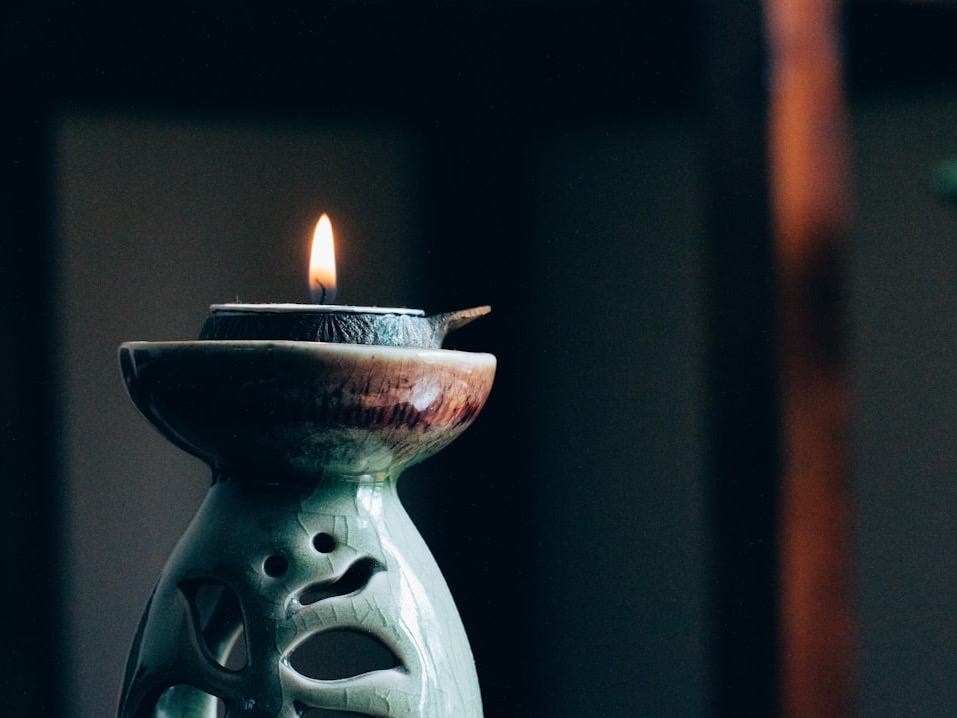 rule of thirds photography of lit candle