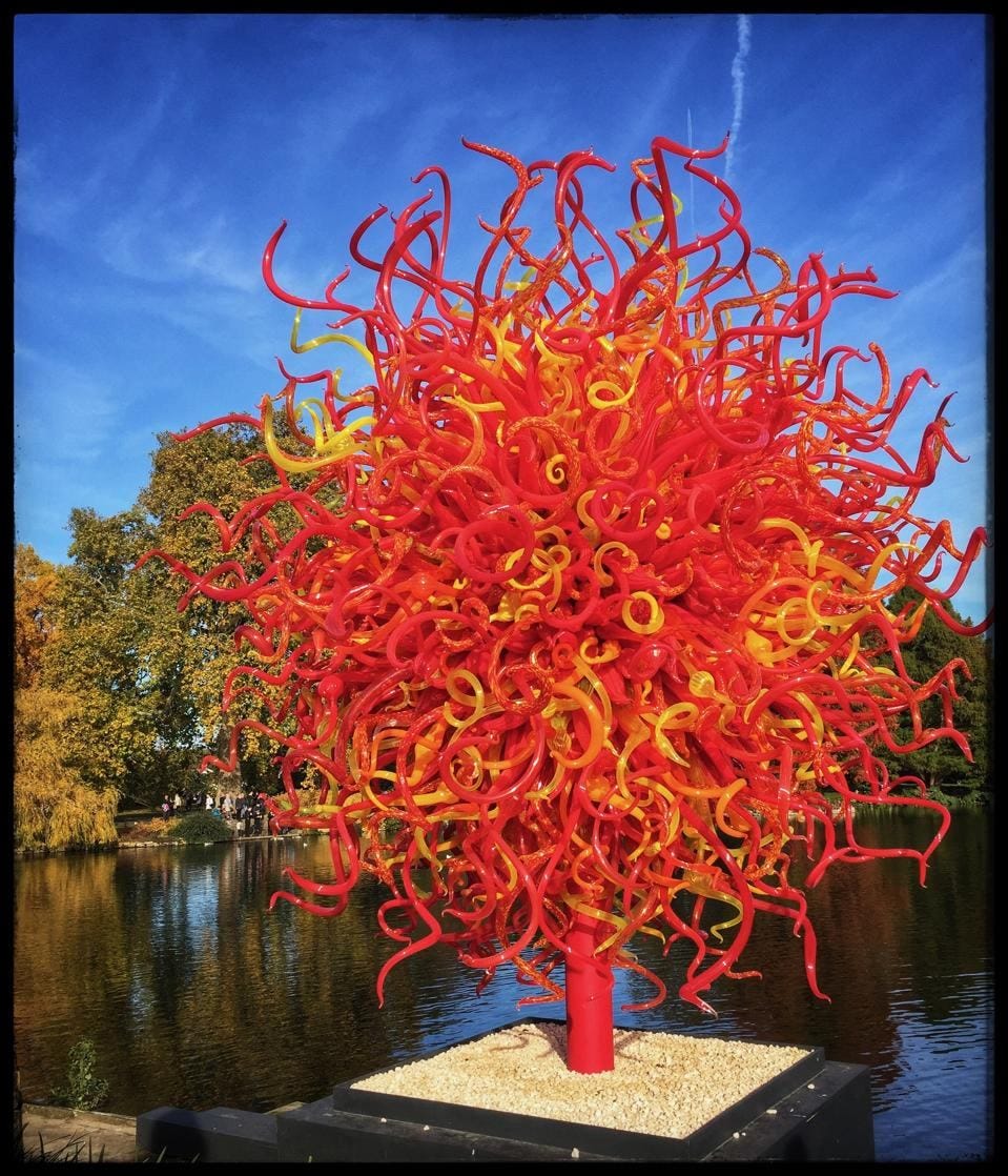 Photo of a glass sculpture of a fall tree by Dale Chihuly, Kew Gardens, representing The potential of our lives' September splendours