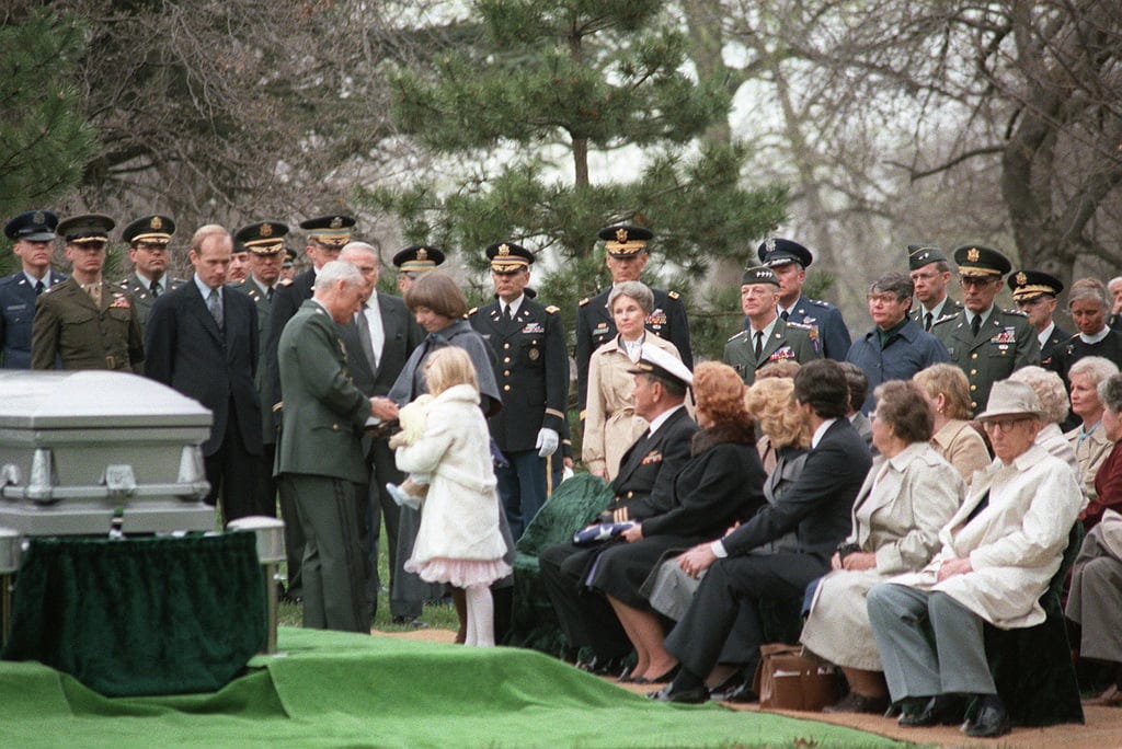 Mrs. Arthur D. Nicholson and her daughter are consoled during the funeral  of Major (MAJ) Nicholson. Nicholson was shot and killed while on duty in  East Berlin - NARA & DVIDS Public
