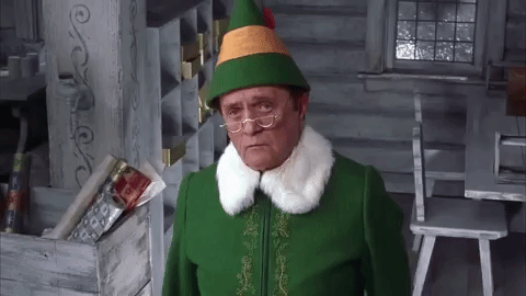 GIF of Bob Newhart as Papa Elf from the movie Elf, looking resigned to his adopted son's goofiness