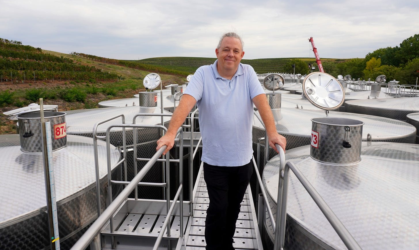 Philip Cox atop some of the many stainless steel tanks at his giant Cramele Recas winery in Romania. Photo (C) Simon J Woolf.