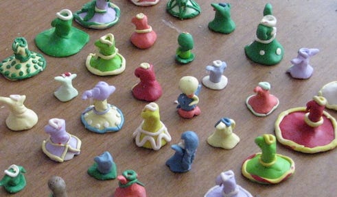 Rows of tiny dresses made of Sculpey clay