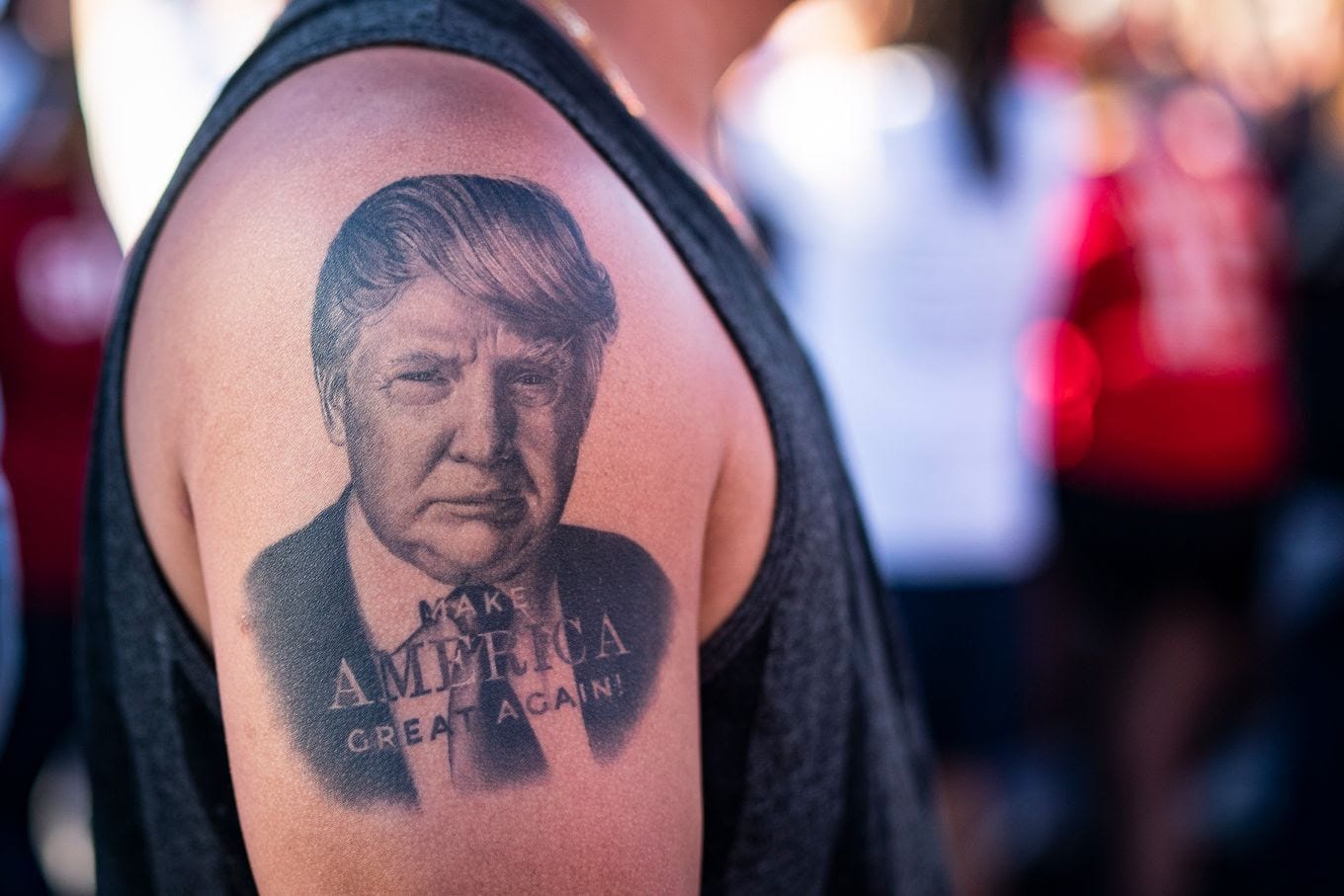 A tattoo of former president Donald Trump is seen on the arm of a supporter as Trump speaks at a campaign rally March 25 in Waco, Tex. (Jabin Botsford/The Washington Post)