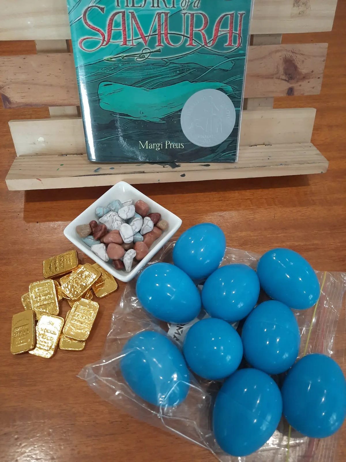 A book and eggs on a table

Description automatically generated with medium confidence
