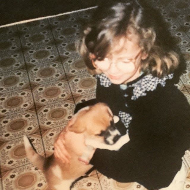 child holding puppy