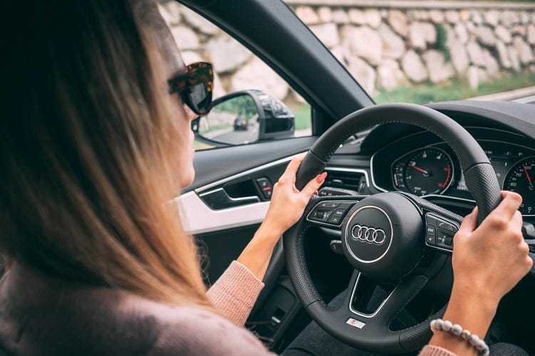 Woman driving car.