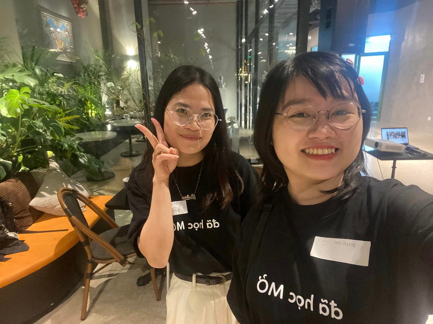 May be an image of 2 people, eyeglasses and text