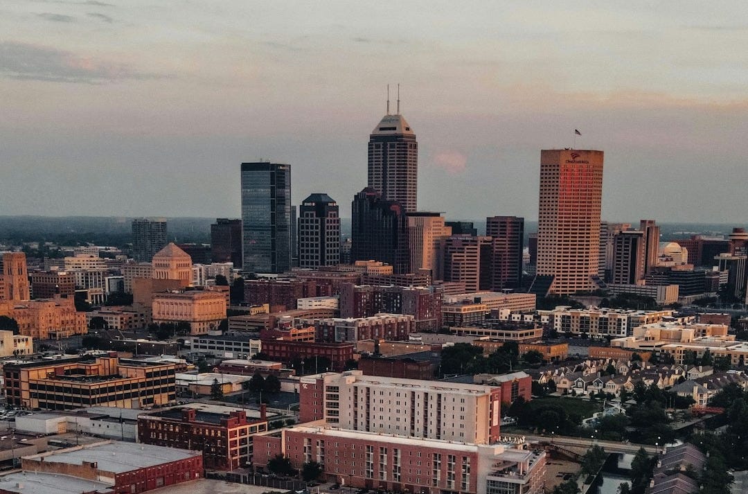 Indianapolis skyline at dusk with a waterway. Indianapolis skyline at dusk with a waterway.