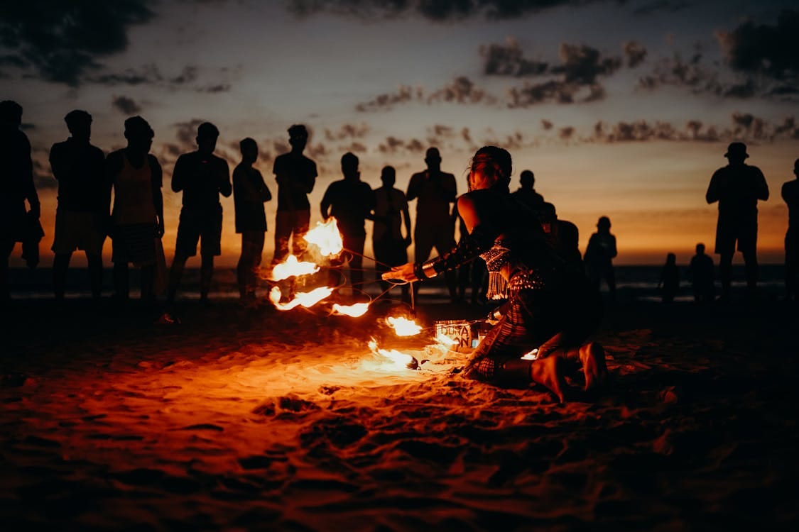 Free People Standing on Beach during Sunset Stock Photo