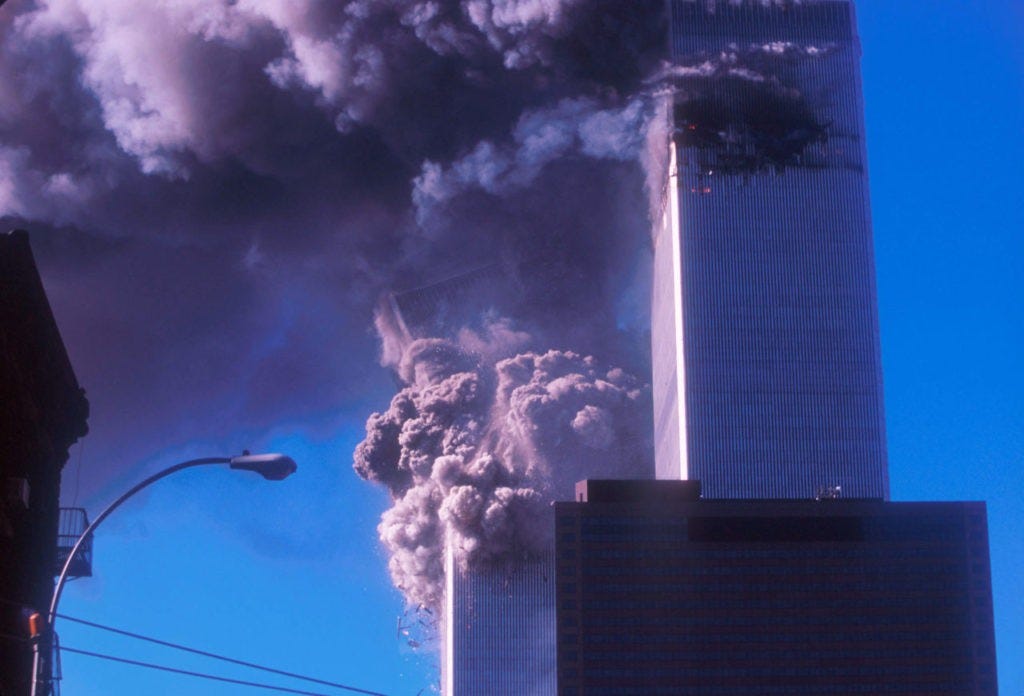 394273 02: One of the World Trade Center's twin towers collapses after it was struck by a commerical airliner in a suspected terrorist attack September 11, 2001 in New York City. (Photo by Ezra Shaw/Getty Images)