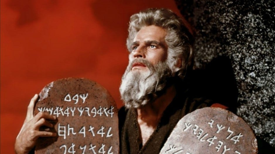 Moses holding the 10 commandments on mount Sinai, movie scene