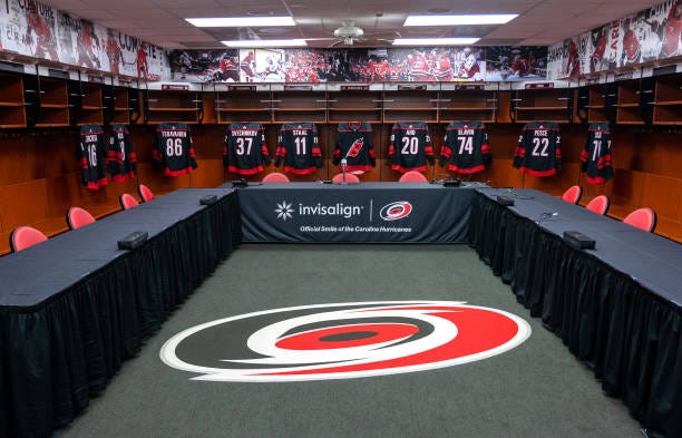 The stage is set inside the Carolina Hurricanes locker room before the start of the first round of the 2021 NHL Entry Draft at PNC Arena on July 23,...